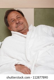 Portrait Of Elderly Man In Bathrobe, Relaxing.