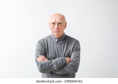 Portrait Of Elderly Man On Light Background