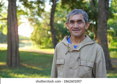 Portrait Elderly Retired Man(soft Focus) Looks Happy In His Travelling At Resort Background Reflection Of The Morning Sunshine,concept Quality Of Life In Elderly People.              