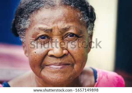 portrait of an elderly woman with beautiful look of Dominican Latin origin looking at the camera 