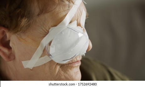 Portrait Of An Elderly Woman With The Eye Patch After The Cataract Surgery. Close Up.