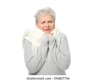 Portrait of elderly woman feeling cold on white background - Powered by Shutterstock