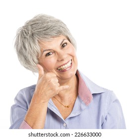 Portrait Of A Elderly Woman Making A Phone Call Gesture 