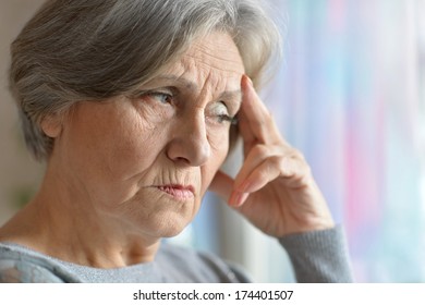 Portrait of a elderly woman in the room - Shutterstock ID 174401507