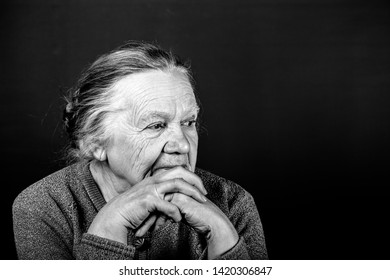 Portrait of elderly woman. Thoughtfulness. Toned.