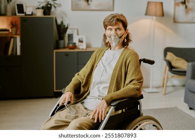 Portrait of elderly woman in wheelchair using oxygen mask at home while wearing cardigan and white shirt - Powered by Shutterstock