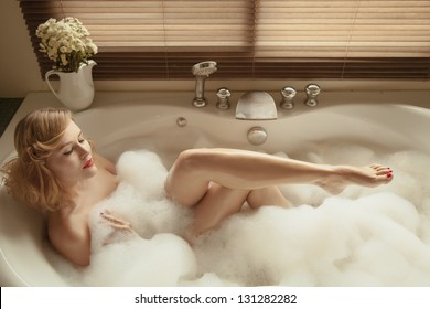 Portrait Of Elegant Beautiful Woman Relaxing In A Spa Bath