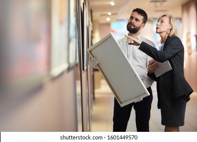 Portrait Of Elegant Mature Woman Buying Painting In Art Gallery Or Museum, Copy Space