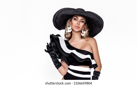 Portrait Of Elegant Woman In A Big Hat Isolated On A White Background In Studio. Retro Style. Pretty Lady In Hat.  Elegance.