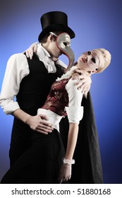 Portrait Of The Elegant Young Couple In Masquerade Costumes. Shot In A Studio.