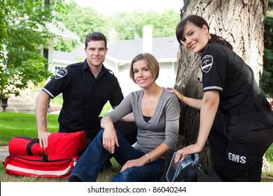 Portrait of emergency team with healthy recovering patient - Powered by Shutterstock