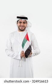 Portrait of Emirati man holding UAE national flag