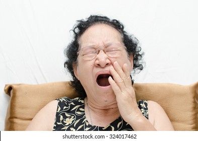 Portrait Of Emotion Asian Senior Woman With Yawn Expression 