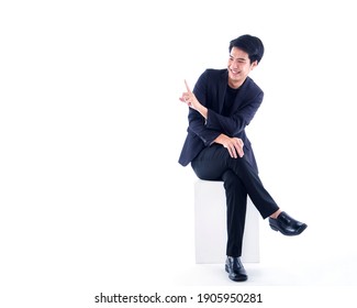 Portrait of emotional handsome man pointing over white background. Space for text