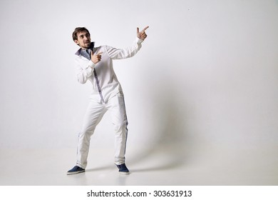 Portrait of an emotional young man wearing white. - Shutterstock ID 303631913