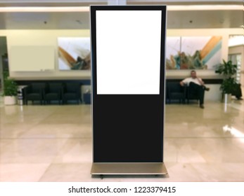 Portrait Empty Poster Light Box In A Waiting Area With Unrecognizable Person Ideal For Copy Space, Advertisement, Digital Signage And Corporate Brand Marketing Campaign