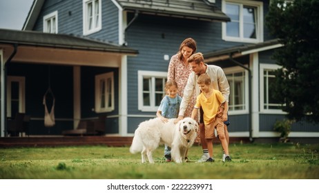 Portrait of a Energetic White Golden Retriever Playing with a Happy Young Family with Kids, Running on a Lawn in Their Front Yard at Home. Cheerful People Petting and Playing with a Dog. - Powered by Shutterstock