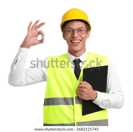 Portrait of engineer in hard hat and reflective vest with clipboard showing ok gesture on white background
