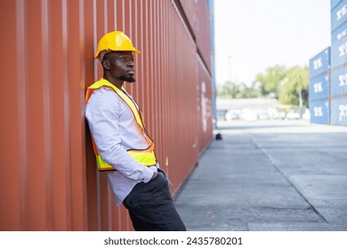 Portrait of an engineer inspecting products using a barcode scanner.