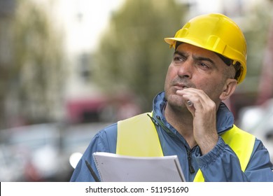 Portrait Of Engineer Smoking Electronic Cigarette. Outdoors