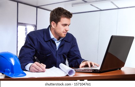 Portrait Of An Engineer Using A Notebook In The Site Office