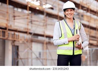 Portrait, engineer and woman with construction, business and smile with inspection, vest and helmet. Face, female person or employee with safety, documents and builder with a hard hat or architecture - Powered by Shutterstock