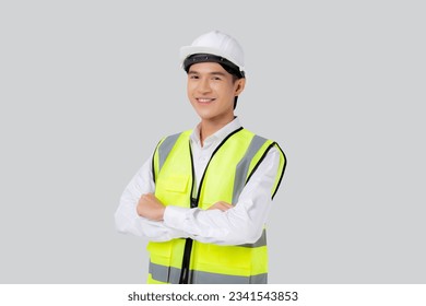 Portrait engineer young asian man wearing helmet standing and smiling with confident isolated on white background, handsome male is architect or contractor arms crossed, industrial concept. - Powered by Shutterstock