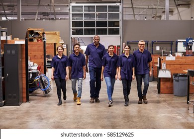 Portrait Of Engineers And Apprentices In Busy Factory - Powered by Shutterstock