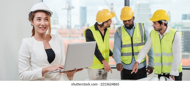 Portrait Of Engineers Facing The Camera As They Wrap Up A Group Discussion For An Architectural Project.