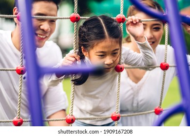 Portrait Of Enjoy Happy Love Asian Family Father And Mother With Little Child Asian Girl Daughter Smiling Playing Moments Good Time At Playground