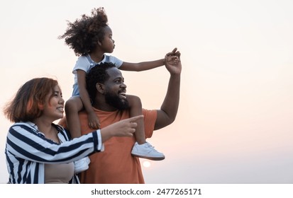 Portrait of enjoy happy love black family.play, having fun, daughter, parenthood, care, superhero.african american father and mother with little african girl child smiling moments good time at home - Powered by Shutterstock