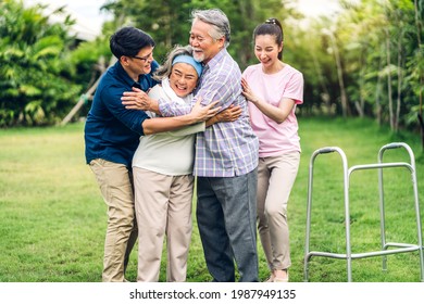 Portrait Enjoy Happy Smiling Love Multi-generation Asian Big Family.Senior Mature Father And Elderly Mother With Young Adult Woman And Son Walking Outdoor In Park At Home.insurance Concept