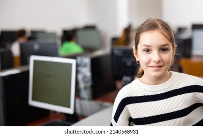 Portrait Of European Teenager Girl Standing In Computer Class.