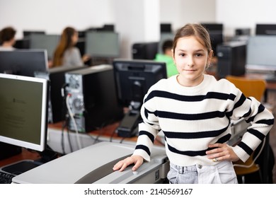 Portrait Of European Teenager Girl Standing In Computer Class.