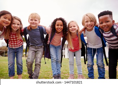 Portrait Of Excited Elementary School Pupils On Playing Field At Break Time - Shutterstock ID 1447101821