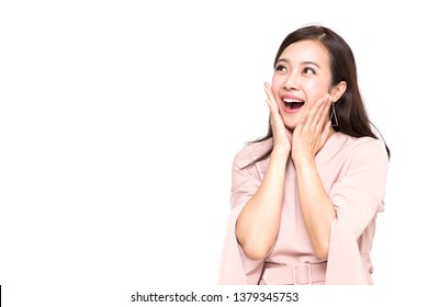 Portrait Of Excited Screaming Young Asian Woman Standing In Pink Dress Isolated Over White Background, Wow And Surprised Concept