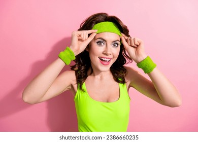 Portrait of excited sporty girl hands fix adjust headband toothy smile enjoy intense fitness activity isolated on pink color background - Powered by Shutterstock