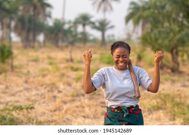 portrait of an excited young female african farmer - Shutterstock ID 1945142689