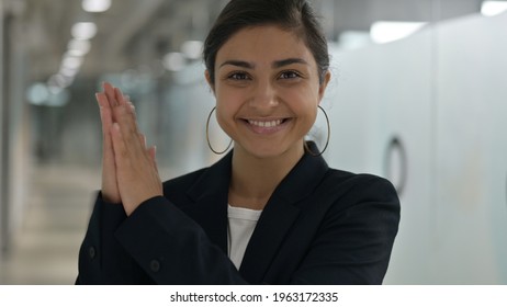 Portrait of Excited Young Indian Businesswoman Clapping 