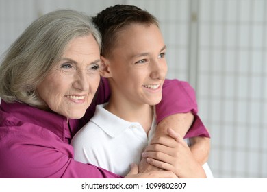 Portrait Of Exited Grandmother And Grandson