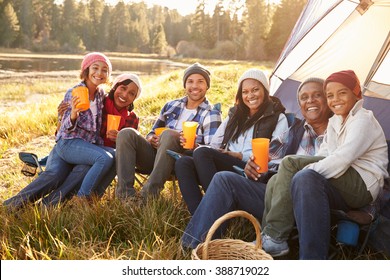 Portrait Of Extended Family Group Camping By Lake