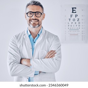 Portrait, eye exam and arms crossed with an optometrist man in his office for healthcare or vision improvement. Medical, frame and glasses with a happy doctor in a clinic for assessment and testing