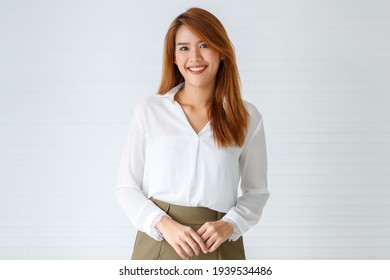 Portrait face of beautiful attractive smile young adult Asian woman in positive pose looking at the camera with happy in studio against white background. Businesswoman or entrepreneur girl concept.