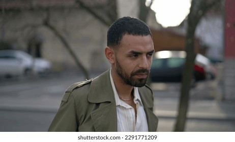Portrait face of a Middle Eastern young man with serious expression staring at camera - Shutterstock ID 2291771209