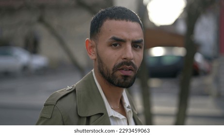 Portrait face of a Middle Eastern young man with serious expression staring at camera - Shutterstock ID 2293459063