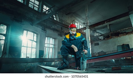 Portrait factory senior welder worker on manufacture workshop background