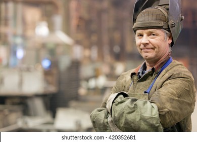 Portrait factory senior welder worker on manufacture workshop background - Powered by Shutterstock