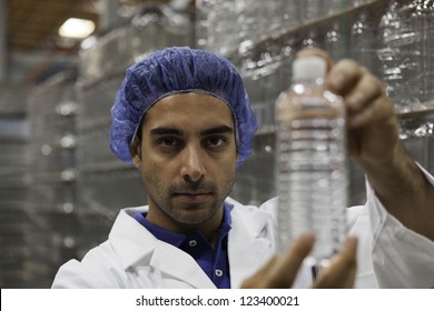 Portrait Of Factory Worker Holding Water Bottle