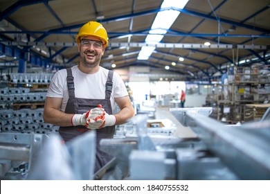 Portrait of factory worker in protective equipment in production hall. - Powered by Shutterstock