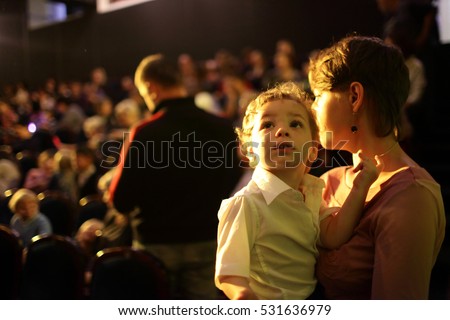 Portrait of family at a concert in the evening